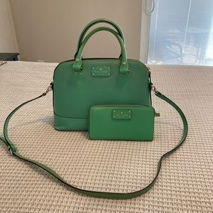 Green Kate spade bag w crossbody strap and matching wallet.